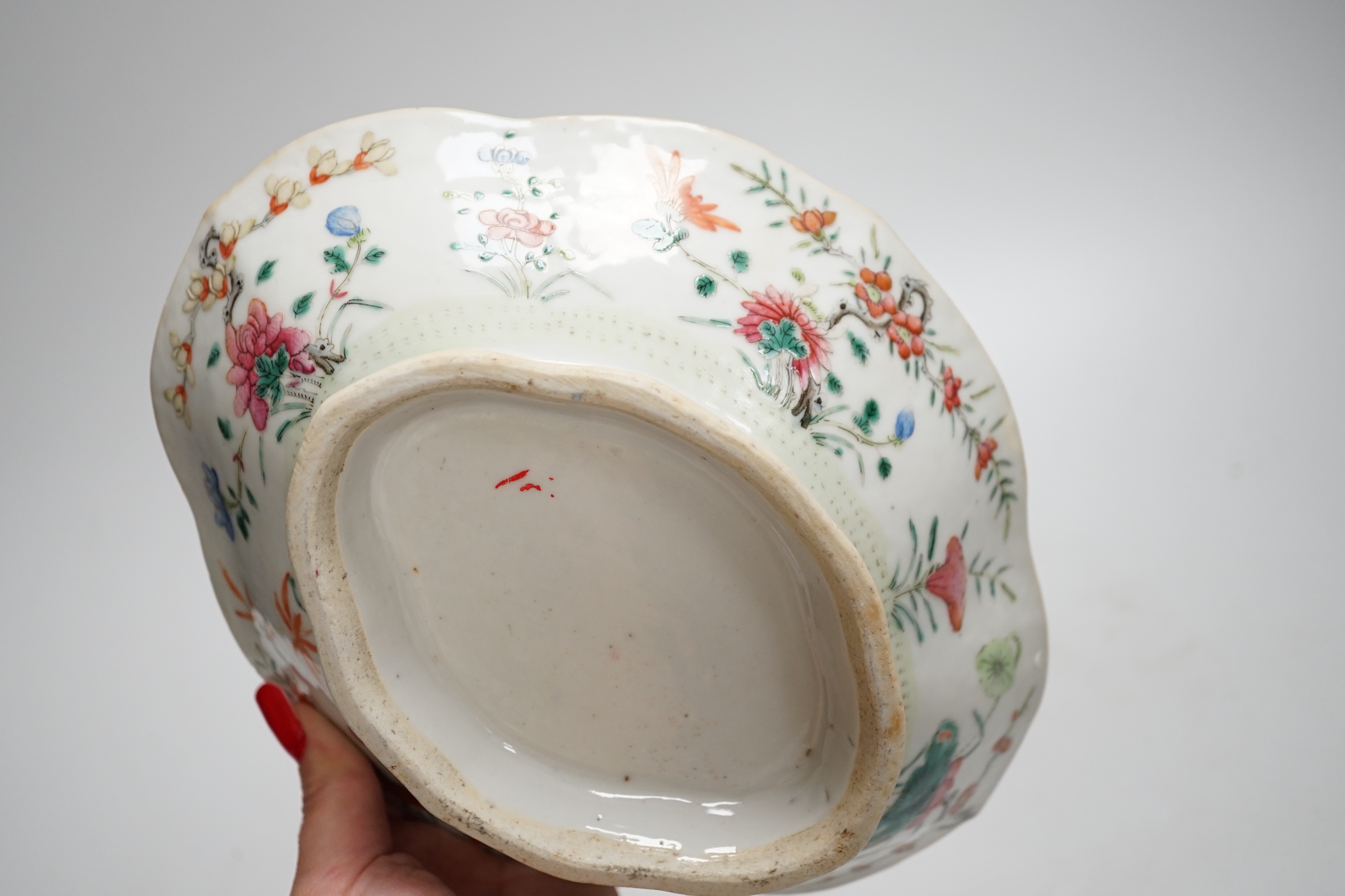 A 19th century Chinese blue and white ingot shaped dish and a famille rose footed dish, the largest 25cm wide (2)